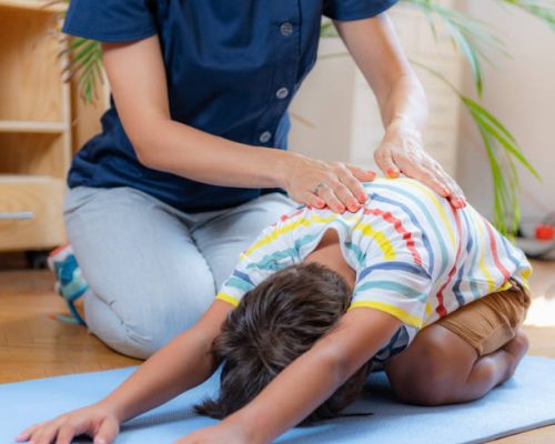 Lower back stretch with physical therapist.